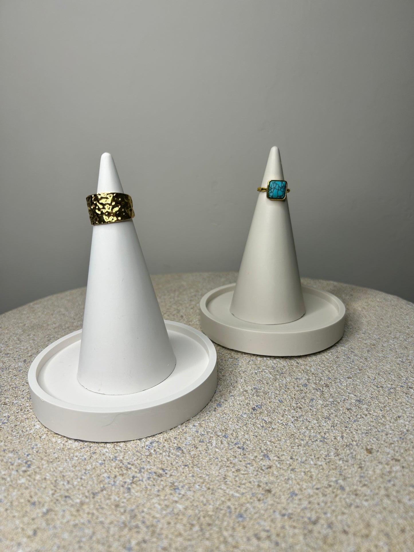 Handmade Home Accessories - a white and greige ring holders with trinket trays, with gold rings on for display purposes.