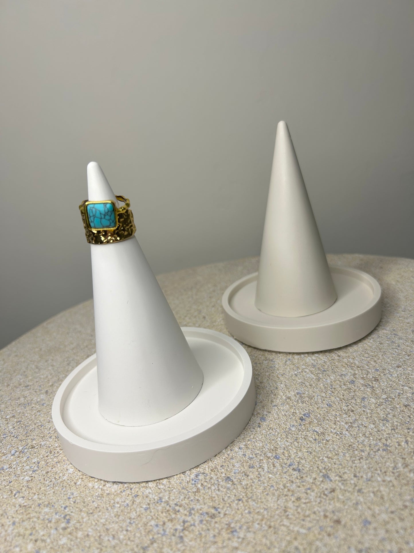 Handmade Home Accessories - a white and a greige ring holder on trinket dishes, the white is displaying two gold rings