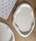 Artisan-crafted abstract ceramic tray with a soft matte finish, perfect as a decorative accent or functional piece for handmade home interiors.