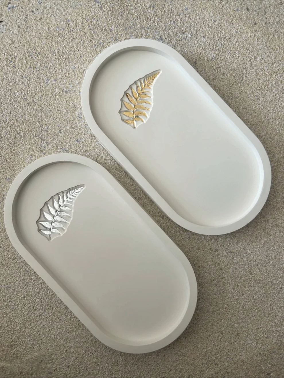 Handmade Home Accessories - White oval shaped trinket trays, with fern leaf subtle design, one in gold, one in silver.