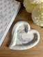 Handmade home accessory – grey marbled Jesmonite heart tray styled with soft florals and a textured journal. A perfect sustainable decor piece for jewellery or keys.