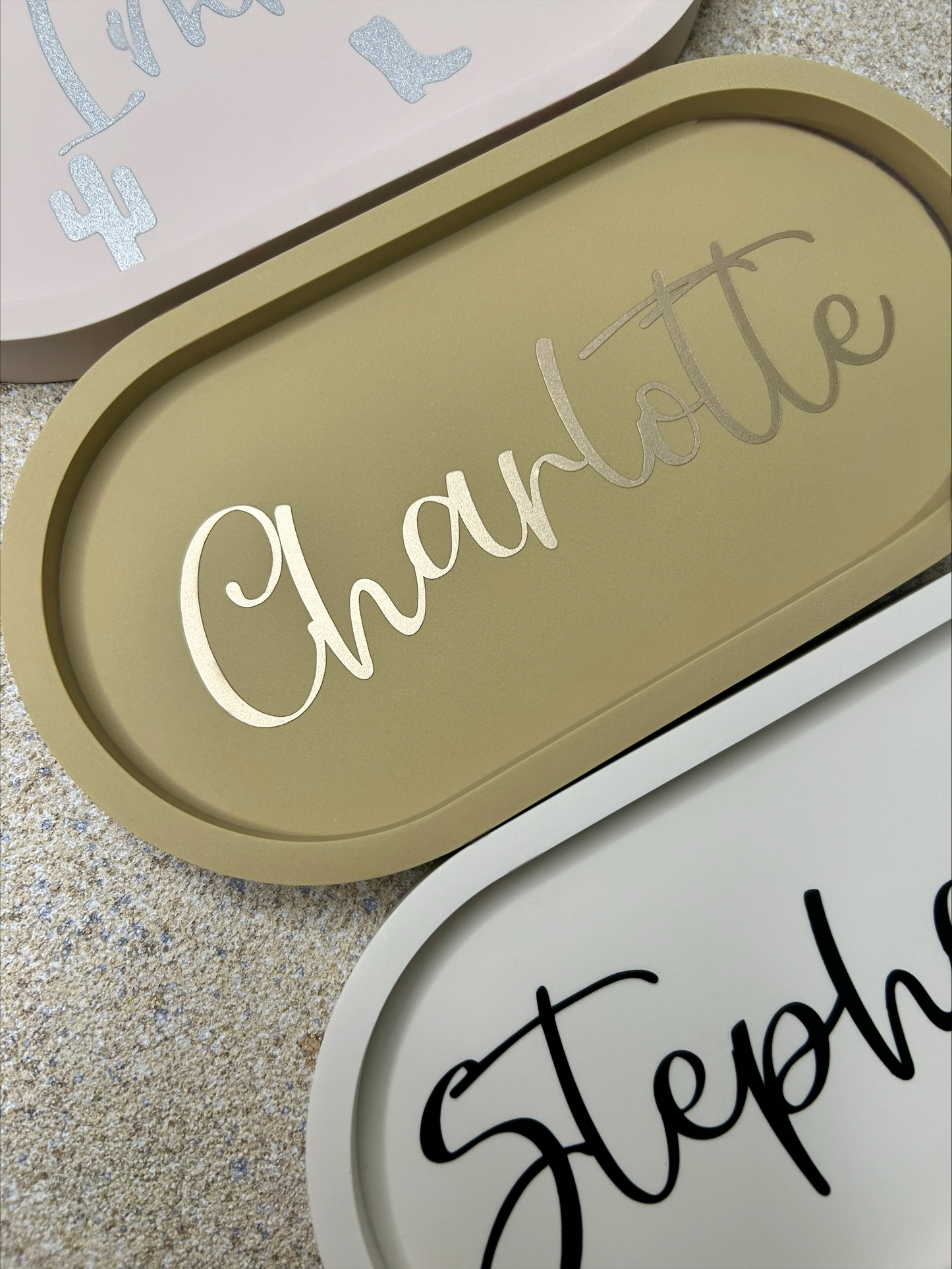 Handmade Home Accessories - A close up shot of a brown trinket tray with the name Charlotte on in Gold