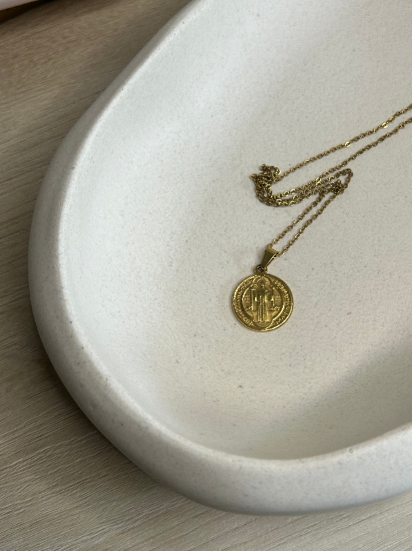 Handmade Home Accessories - A close up shot of one side of the drift bowl that is displaying a gold coin necklace.