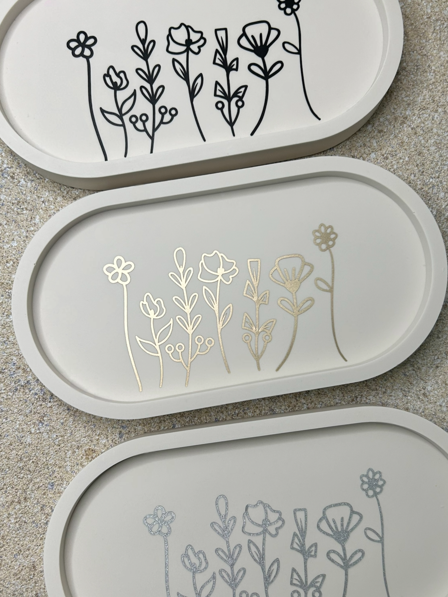 Handmade Home Accessories -  three floral trinket trays with black, gold and silver designs from a birds eye view