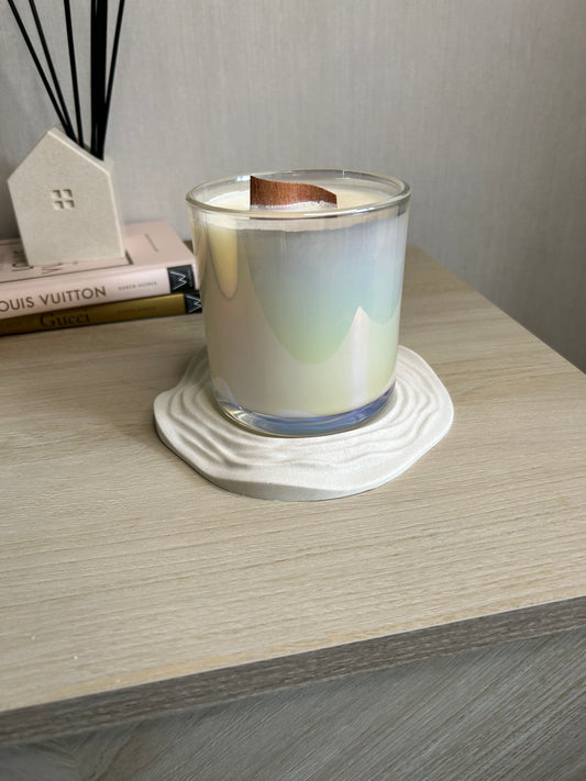 Handmade Home Accessories - A picture of the ripple candle dish with a candle on.