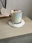 Handmade Home Accessories - A picture of the ripple candle dish with a candle on.