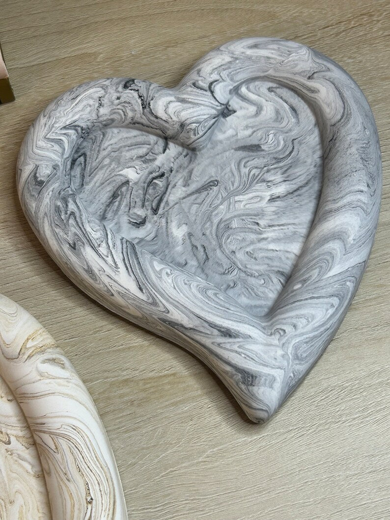 Handmade Home Accessories - a Black marble heart shaped chunky trinket tray, on a wooden surface. front view.