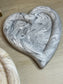 Handmade Home Accessories - a Black marble heart shaped chunky trinket tray, on a wooden surface. front view.