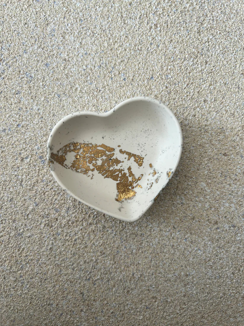 Handmade Home Accessories - A heart shaped trinket dish in a cream colour with black splatters and gold leaf details.