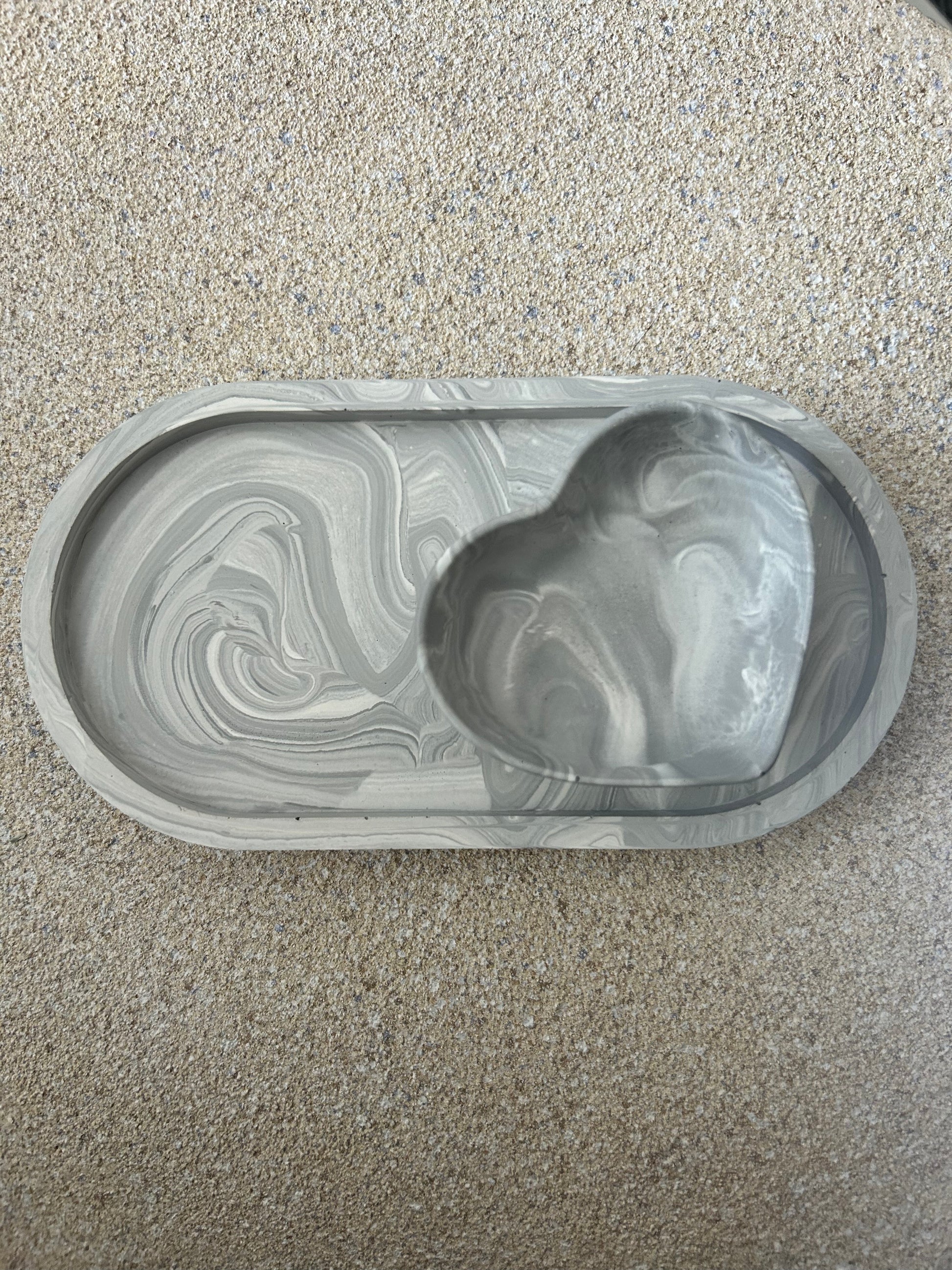 Handmade Home Accessories - a image of a grey marble trinket dish with a matching grey marble heart dish.