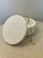 Handmade Home Accessories - a white textured pot wit a gold  necklace draped out