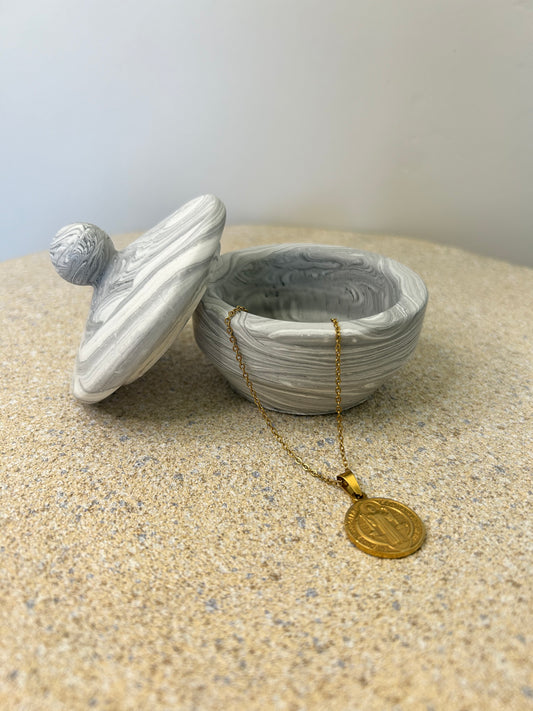 Handmade Home Accessories - a black marble trinket pot with a gold coin necklace draped out