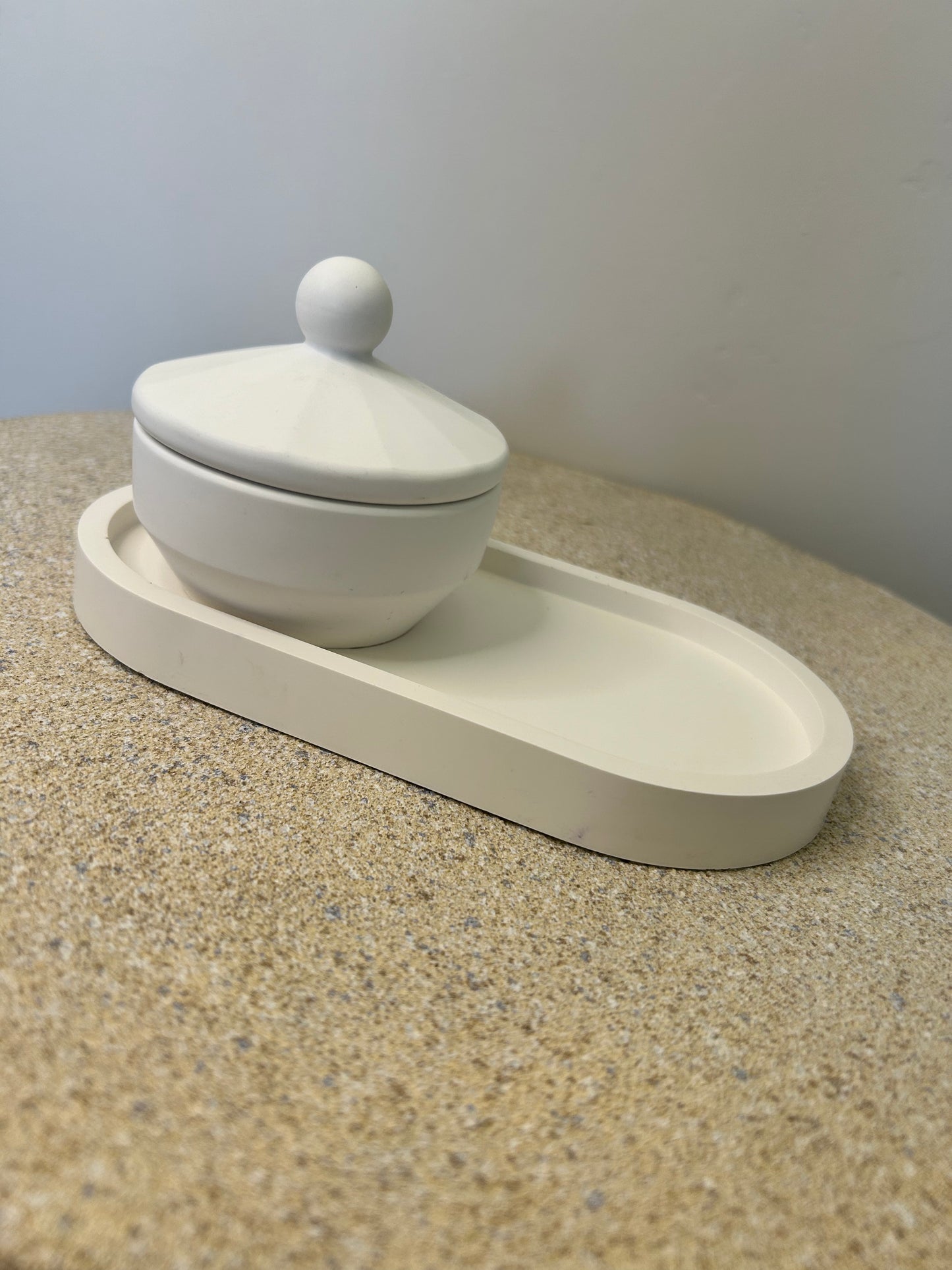 Handmade Home Accessories - a pure white trinket pot on a pure white trinket tray on a natural stone background