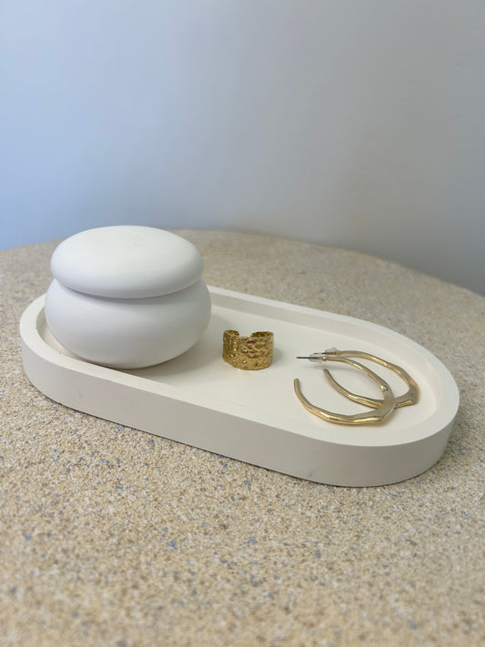 Handmade Home Accessories - a pure white mushroom style trinket pot on a white trinket tray with a gold ring and pair of hoops on.