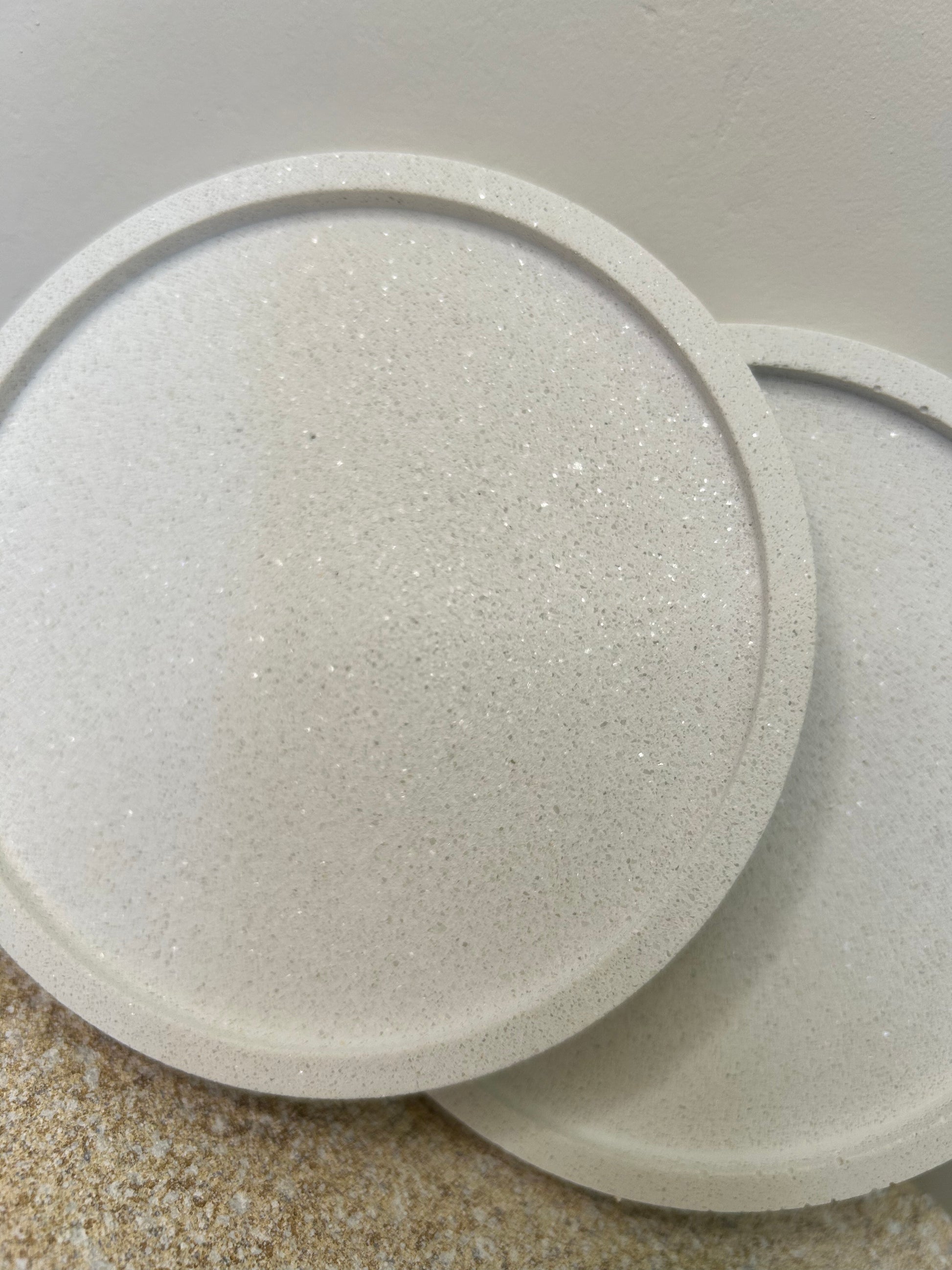 Handmade Home Accessories - a close up shot of a white marble coaster showing it glistening in the sunlight