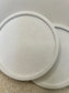 Handmade Home Accessories - a close up shot of a white marble coaster showing it glistening in the sunlight