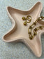 Handmade Home Accessories - a cloe up shot of the peach starfish tray with jewellery in