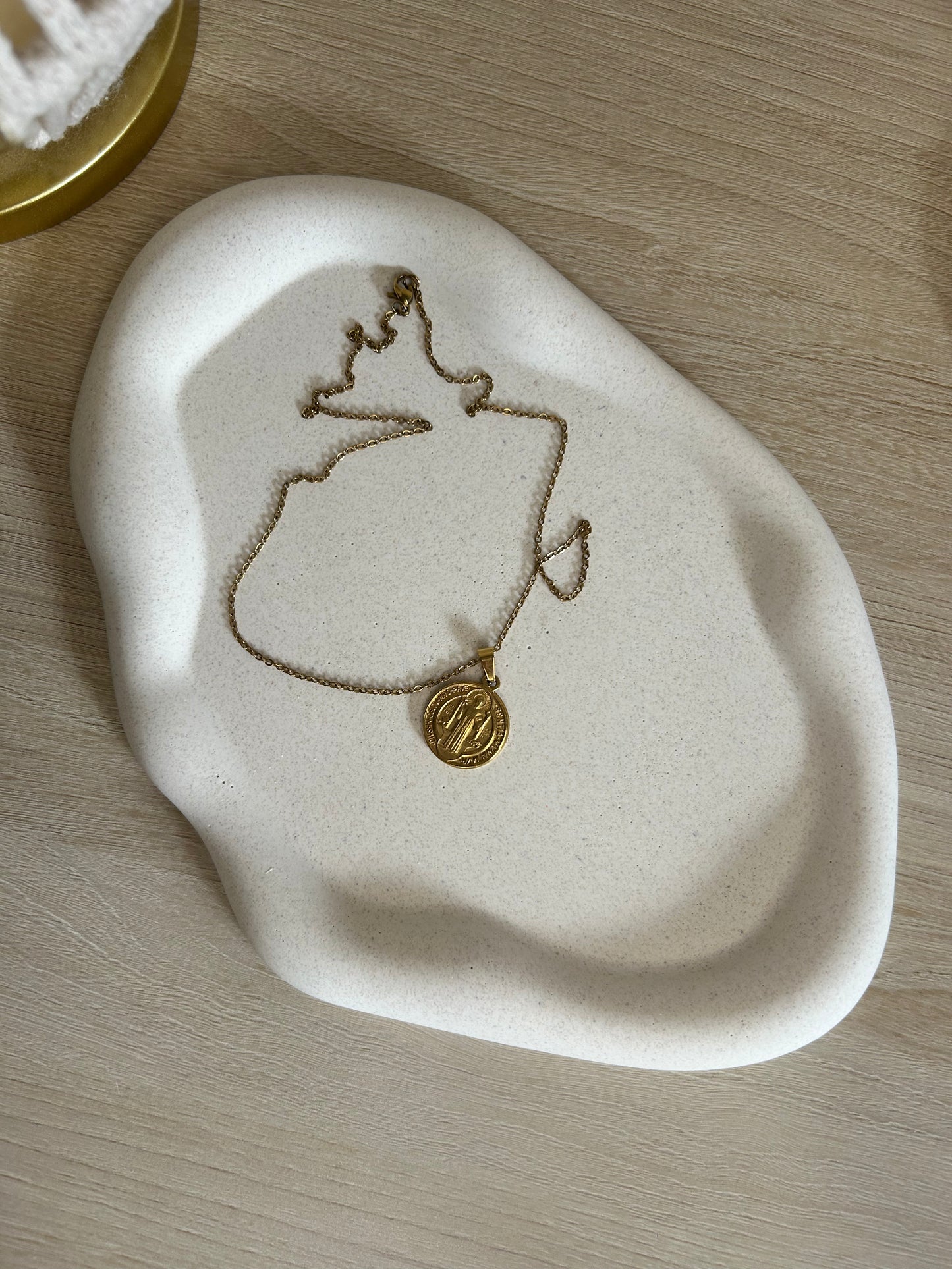 Handmade Home Accessories - A birdseye view shot of the pebble tray with a gold necklace on