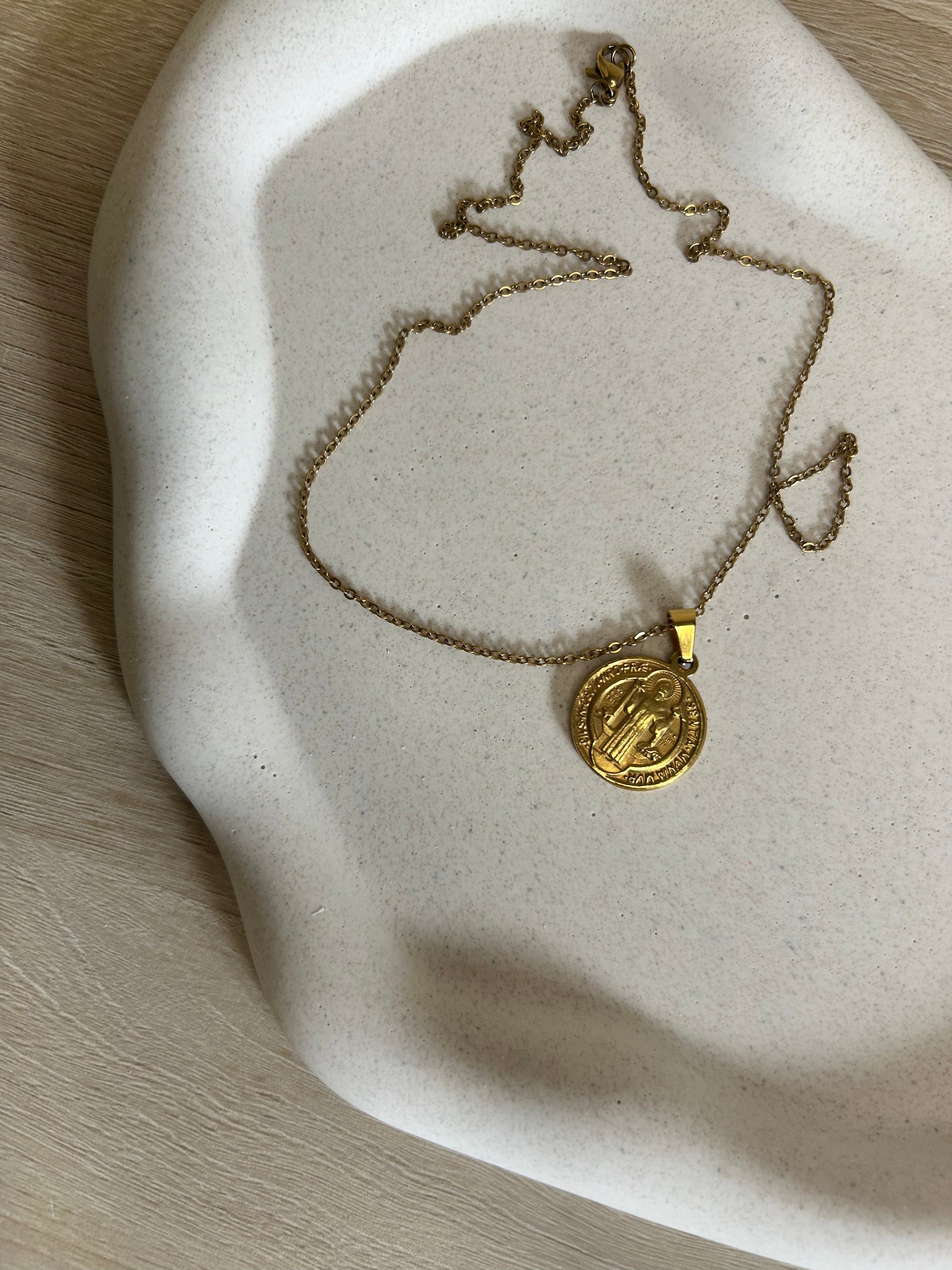 Handmade Home Accessories - A close up of the Pebble trinket tray displaying a gold necklace.