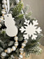 Handmade Home Accessories - A shot of the white marble snowflake and snowman Christmas tree ornaments.