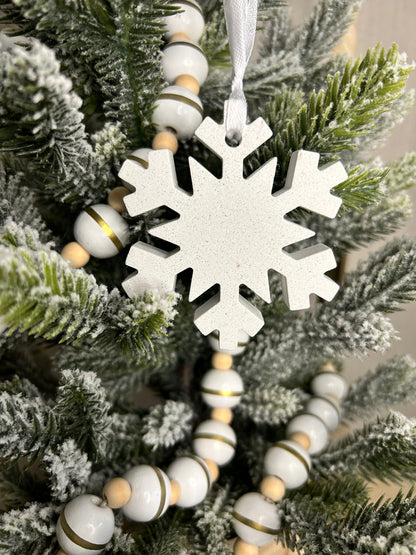 Handmade Home Accessories - A front on shot of the white marble sparkling snowflake Christmas tree ornament.