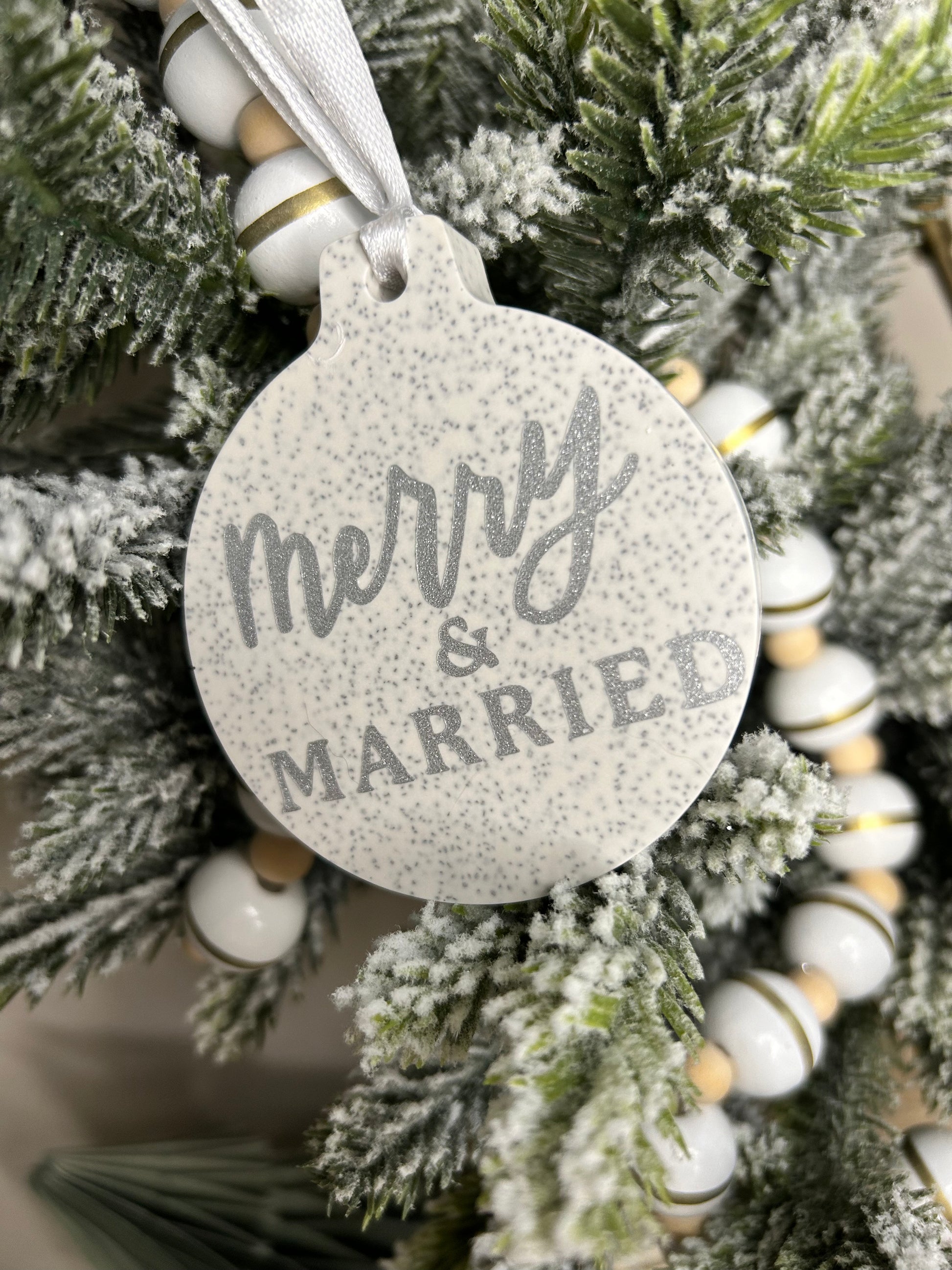 Handmade Christmas Decor - Merry and married bauble with silver sparkling writing.