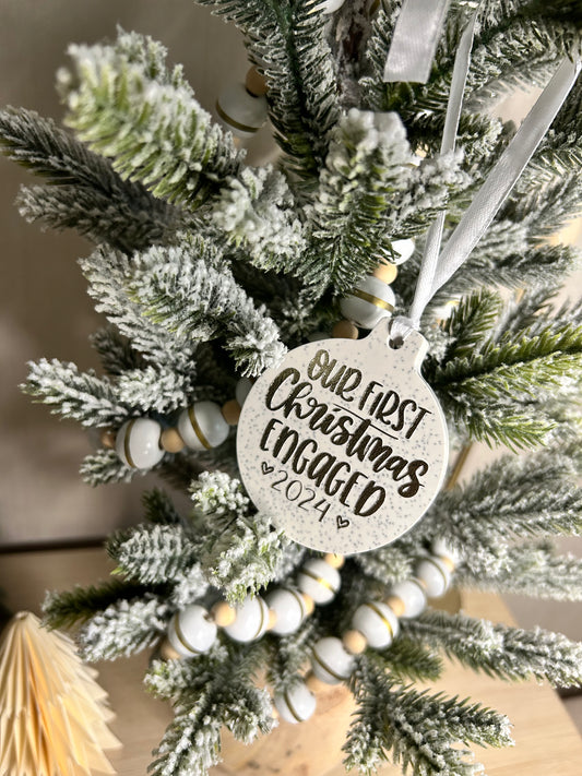 Handmade Christmas Decor - a further away shot Our first christmas engaged bauble in gold sparkling writing on a christmas tree.