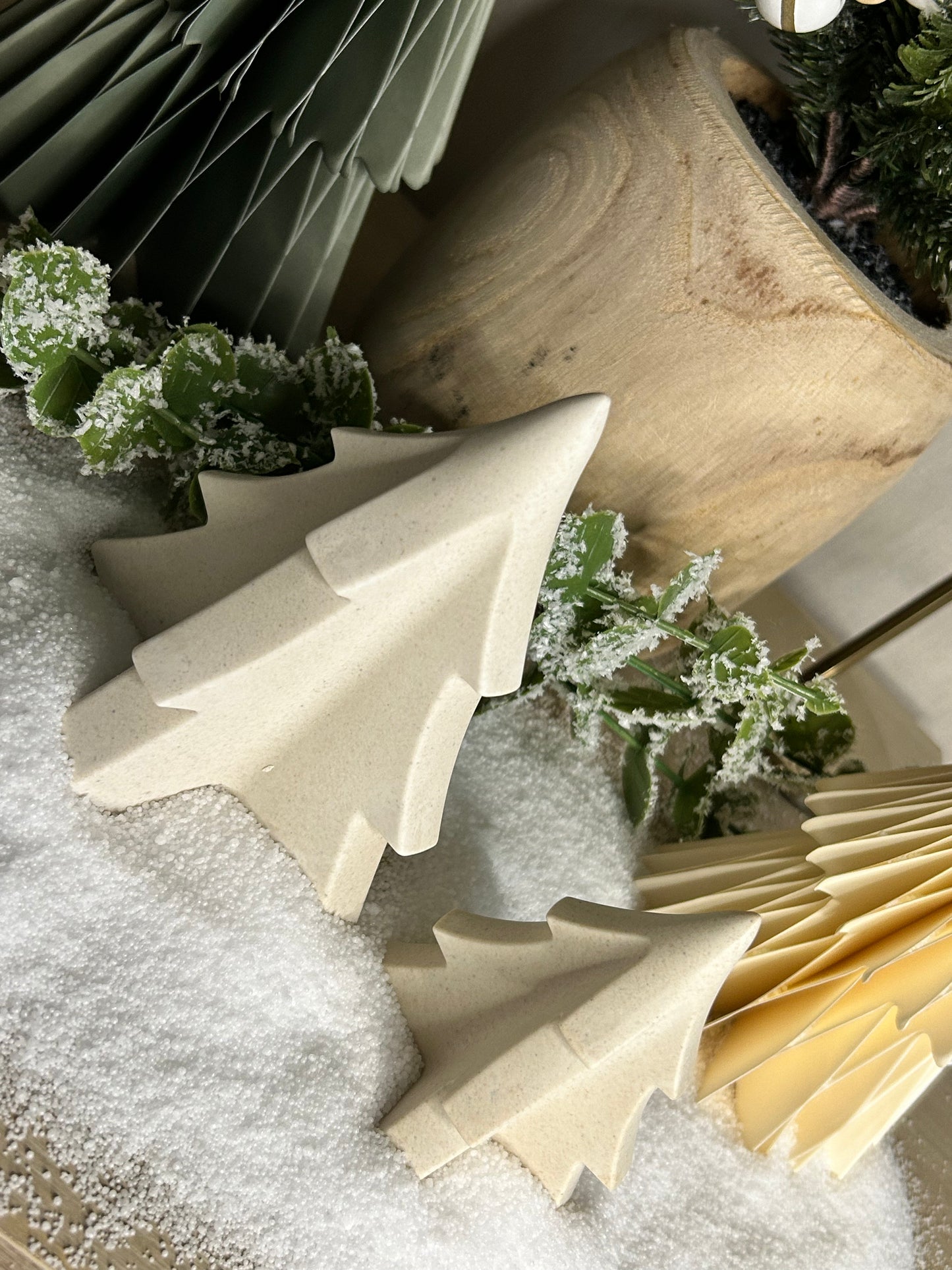 Handmade Home Accessories - An angled shot of two natural stone Christmas trees embedded in stone.