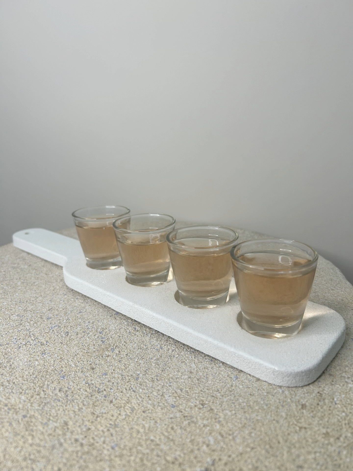 Handmade Home Accessories - a picture of a white marble tray with 4 shots on