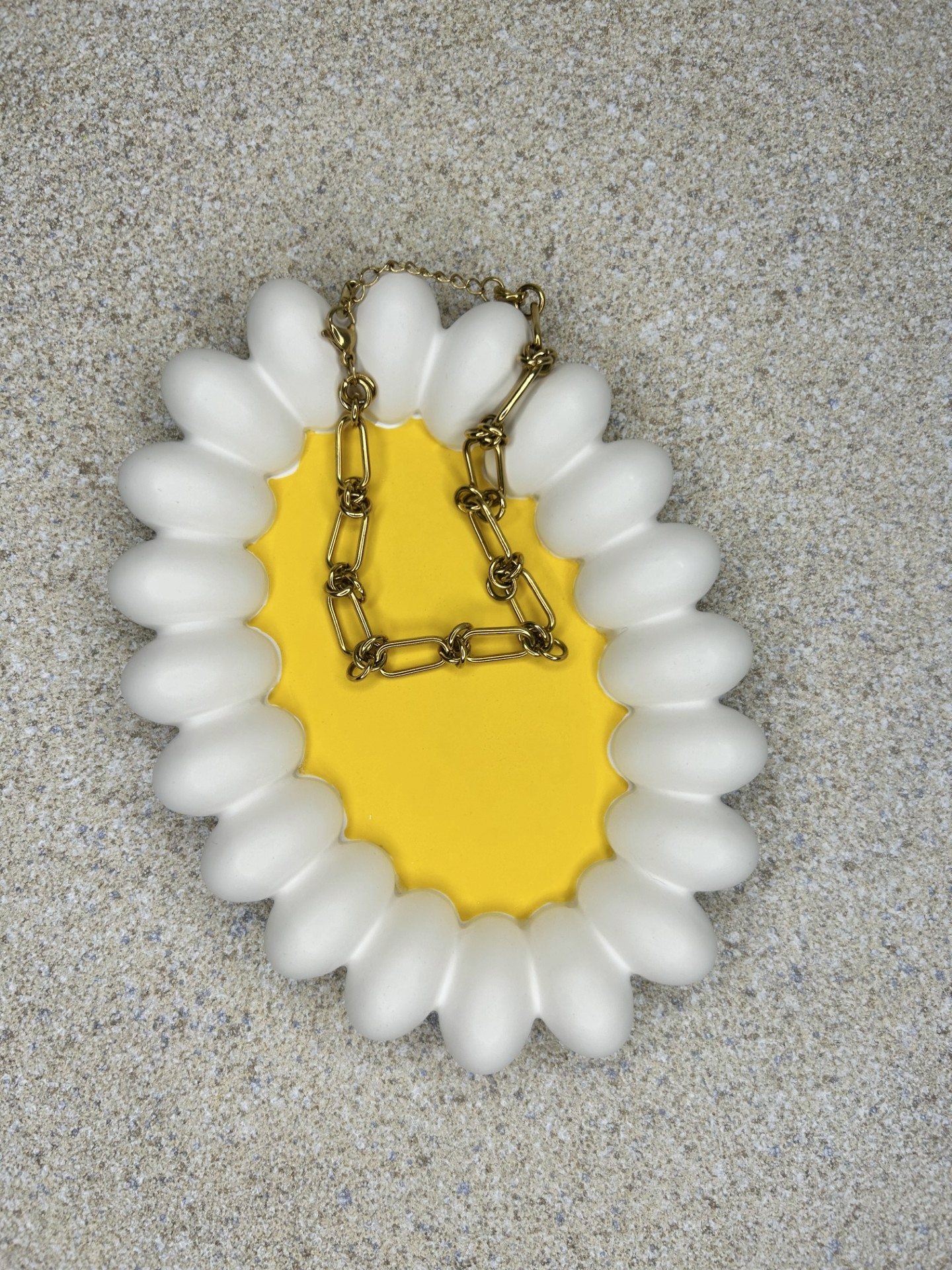 Handmade Home Accessories - a chunky daisy trinket tray with a gold bracelet on