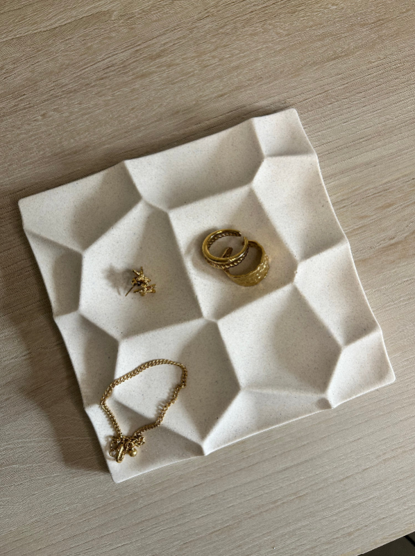 Handmade Home Accessories - A birds eye view shot of the geometric trinket tray, displaying gold jewellery.