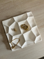 Handmade Home Accessories - A birds eye view shot of the geometric trinket tray, displaying gold jewellery.