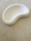 Handmade Home Accessories - A angled view of a white trinket tray that in in the shape of a jelly bean