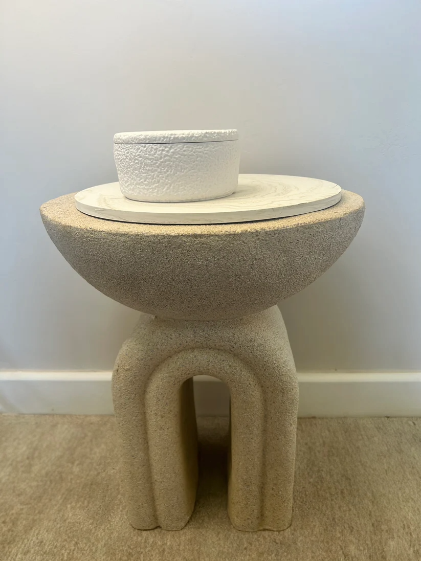 Handmade Home Accessories -  a natural stone table with a griege marble tray and a white textured pot on