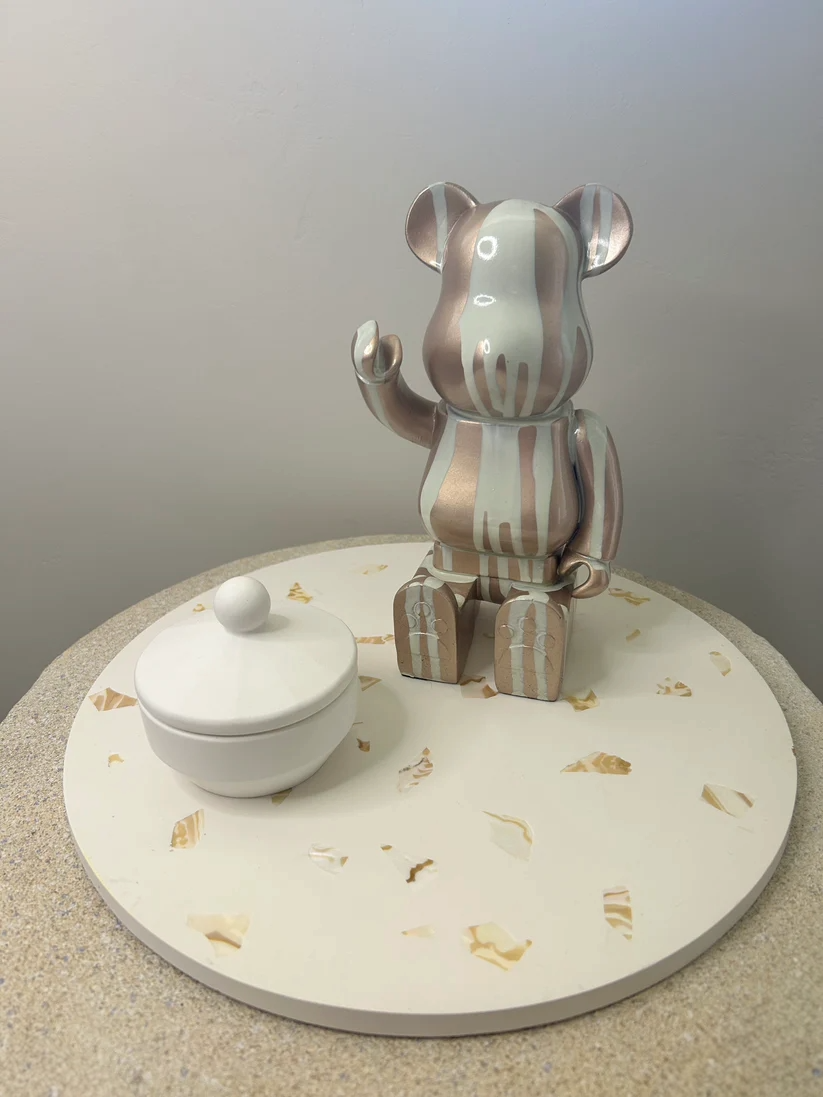 Handmade Home Accessories - a front on view of a large decorative tray that displays a white pot and a bear ornament