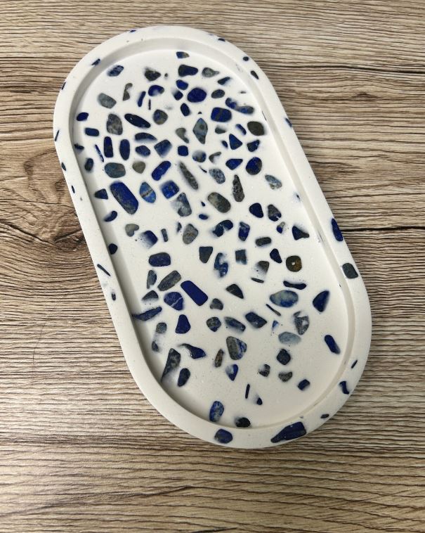 Handmade Home Accesories - A blue and white lapis lazuli oval shaped trinket tray on a wooden background.