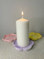 Handmade Home Accessories - A picture of a candle on the purple marble flower candle dish