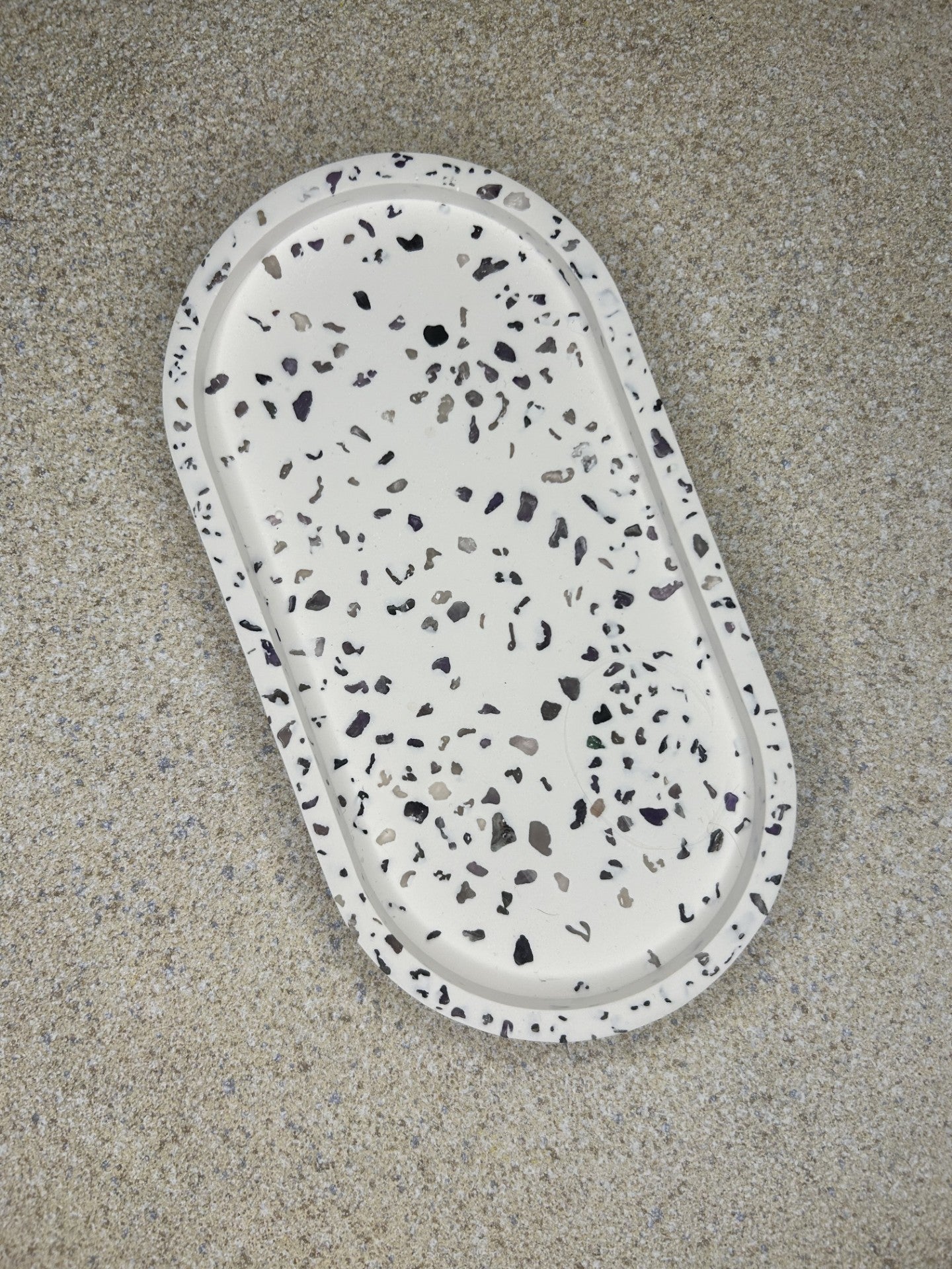 Handmade Home Accessories - birds eye view of our amethyst trinket tray with a terrazzo effect made with the gemstones. 