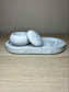 Handmade Home Accessories - a grey marble mushroom pot, open on a grey marble trinket tray on a wooden surface