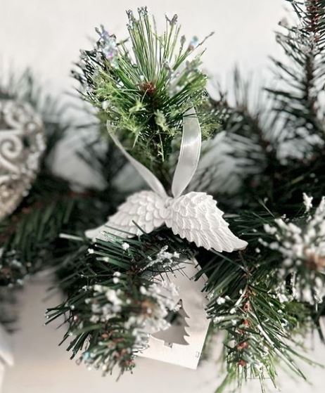 Handmade Home Accessories - a pair of remembrance angel wings on a Christmas wreath 