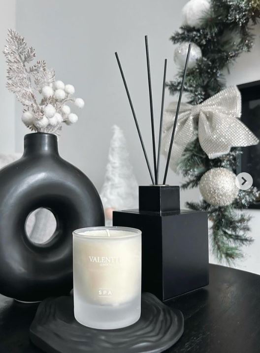 Handmade Home Accessories - A customer photo of our black ripple tray on a black table, displaying a white candle.